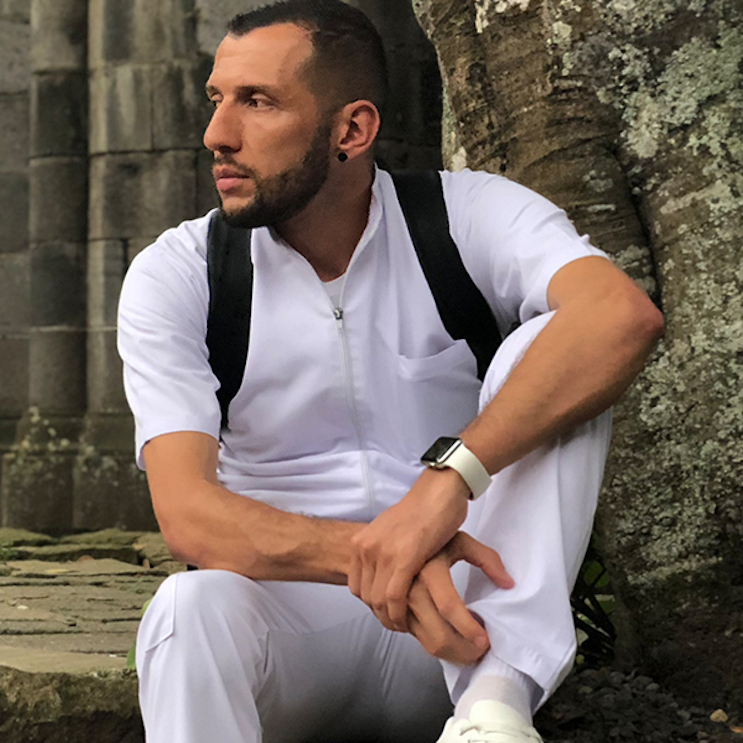 Photo of Allan Rivera sitting outdoors