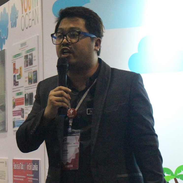 Daren Paul Katigbak speaking with a microphone