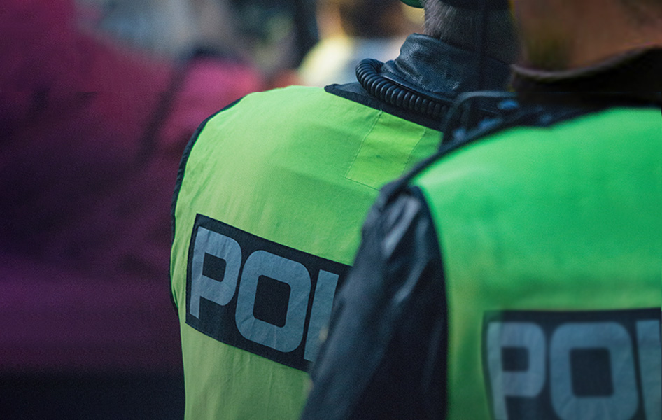 police wearing green police vests