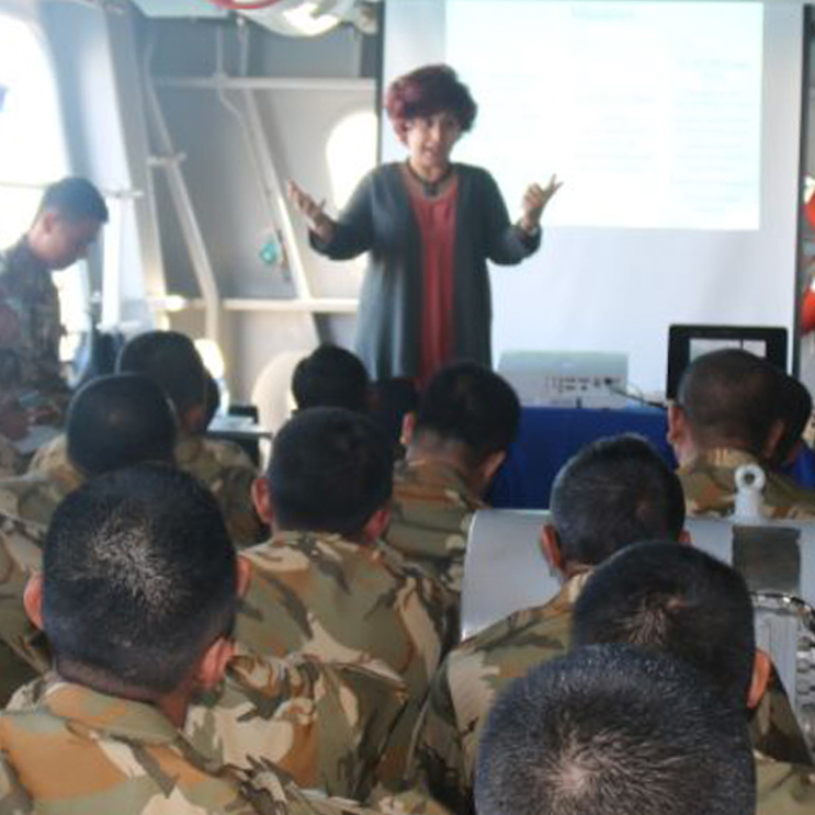 Kinana Rahal speaking to a group of soldiers