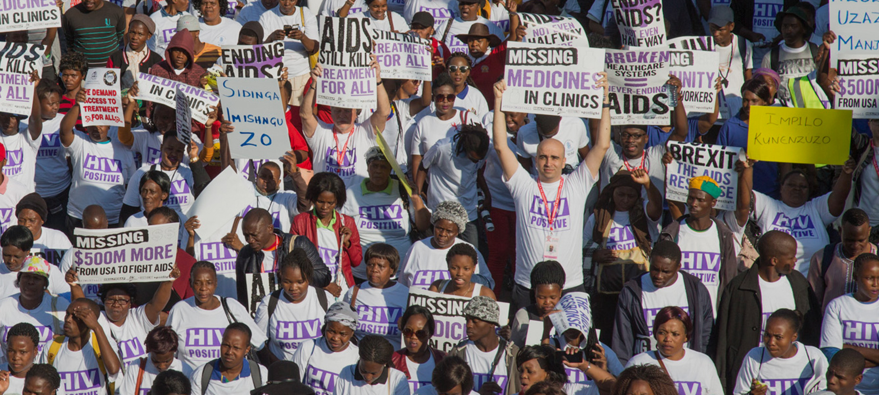 Crowd of people holding protest and activist signs
